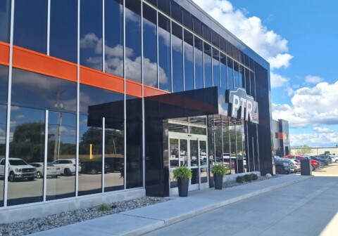 Black and orange MCM wall paneling designed, fabricated and installed by TFC on Premier Truck Rental.