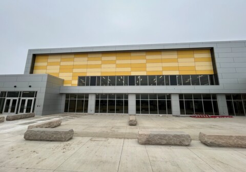 Alternating colors of MCM wall paneling installed by TFC on a high school.