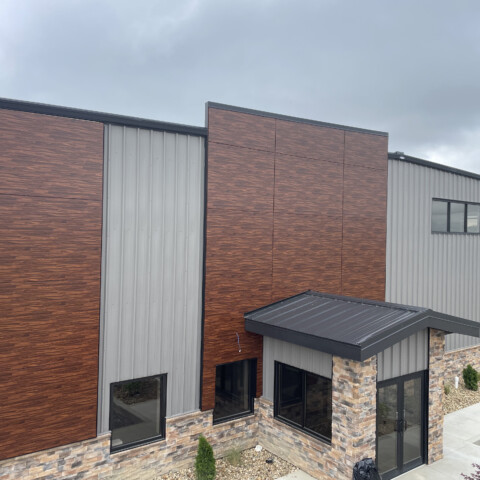 Wood grain MCM paneling installed by TFC on the Lake Lite Solar Technology building.
