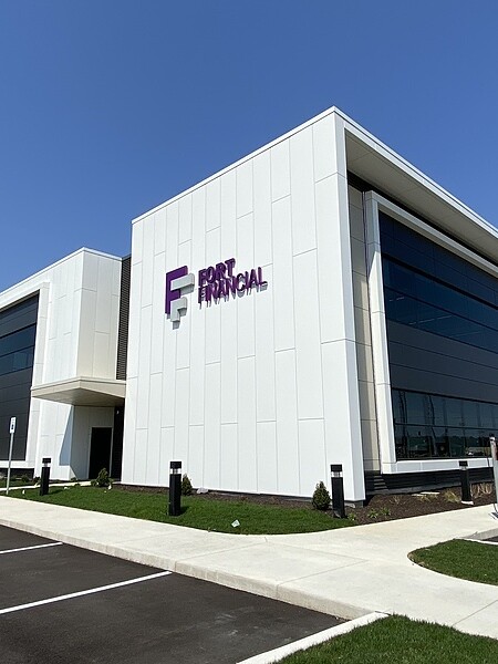 White mcm wall paneling installed by TFC on a commercial bank building.